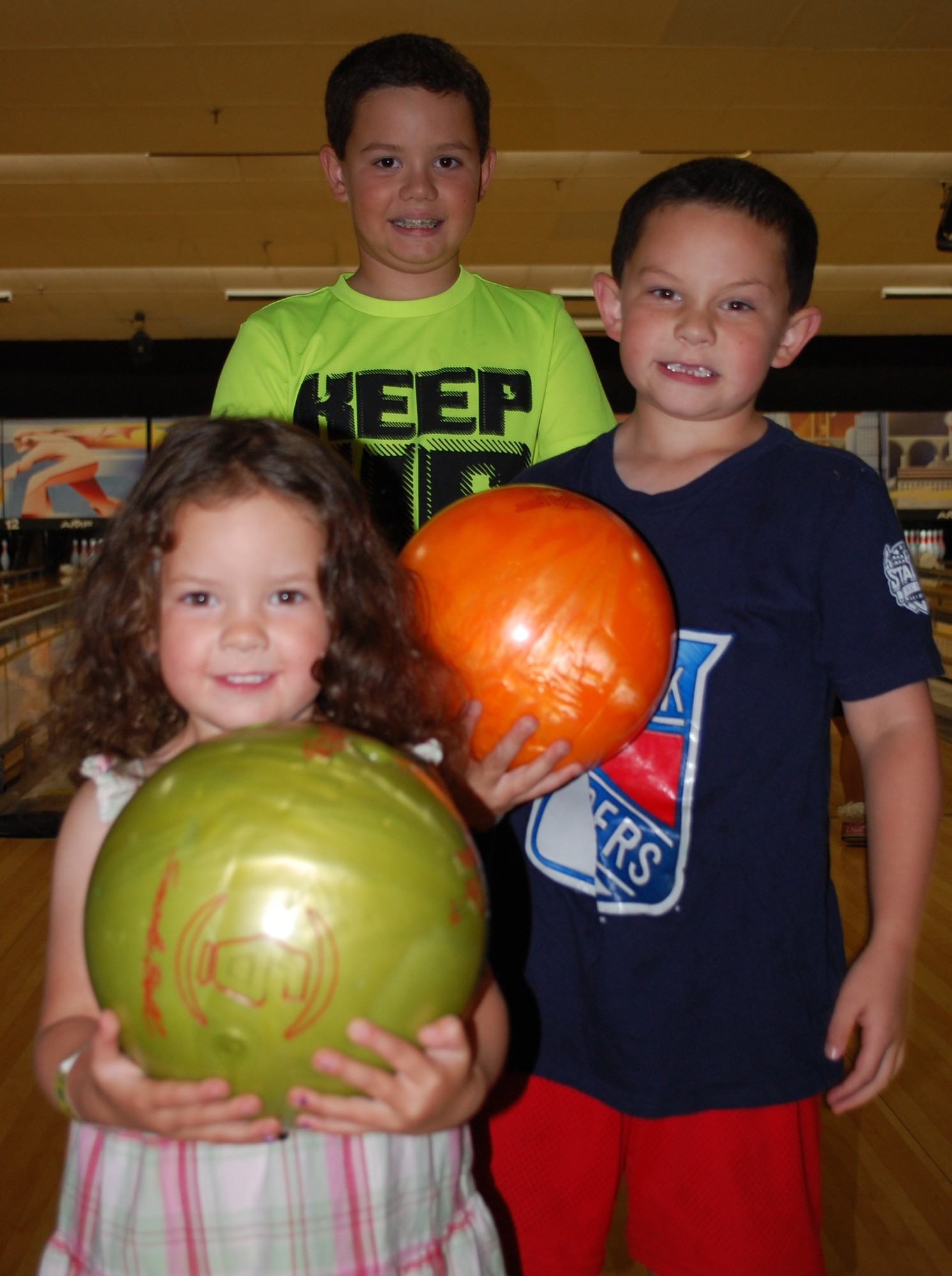 Brandon Martone, 9, Ryan, 6 an Megan, 3, all enjoyed an evening of bowling.
