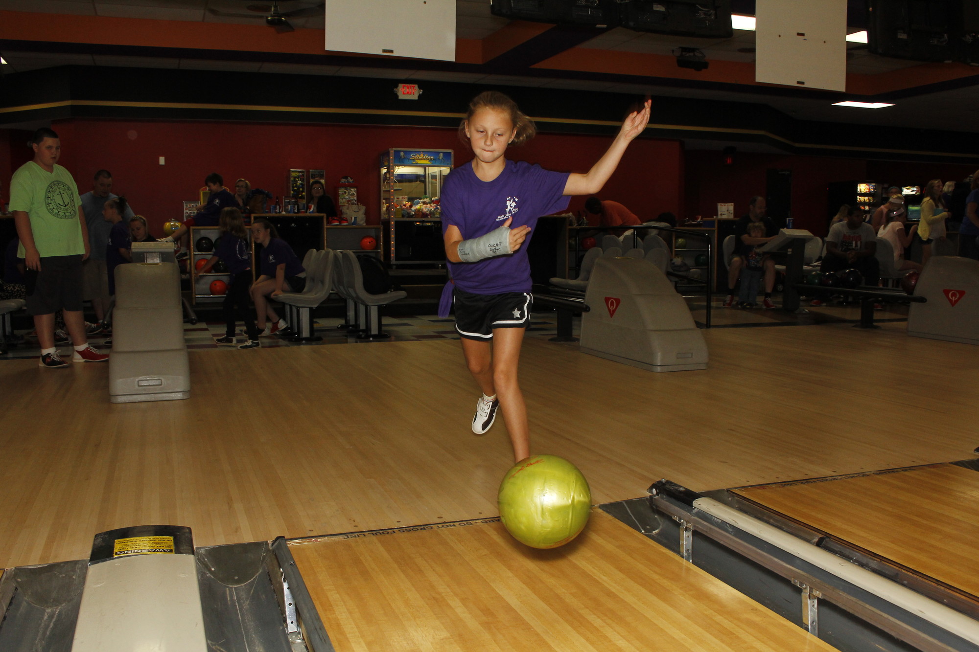 Emma Bollinger, 9, who won a pair of headphones in the night’s raffle draw, fired away at the 20th Annual Bowling for Wishes charity event last Saturday.