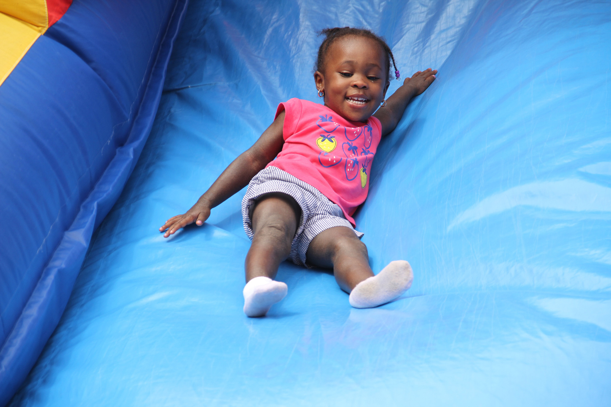 Shaliyah Lewis bounced down the giant slide.