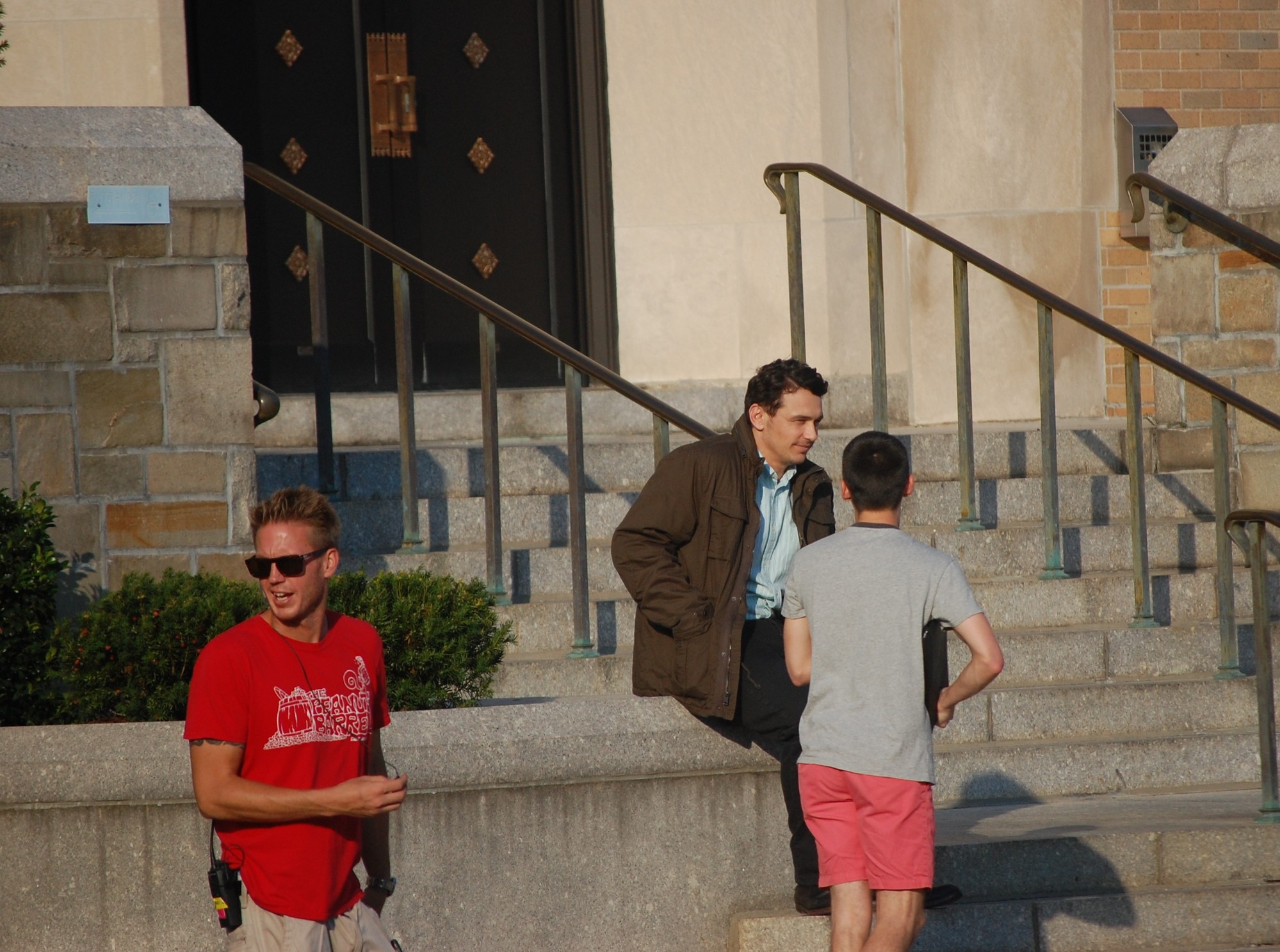 James Franco, center, took a break between takes last week in front of St. Christopher’s Church.