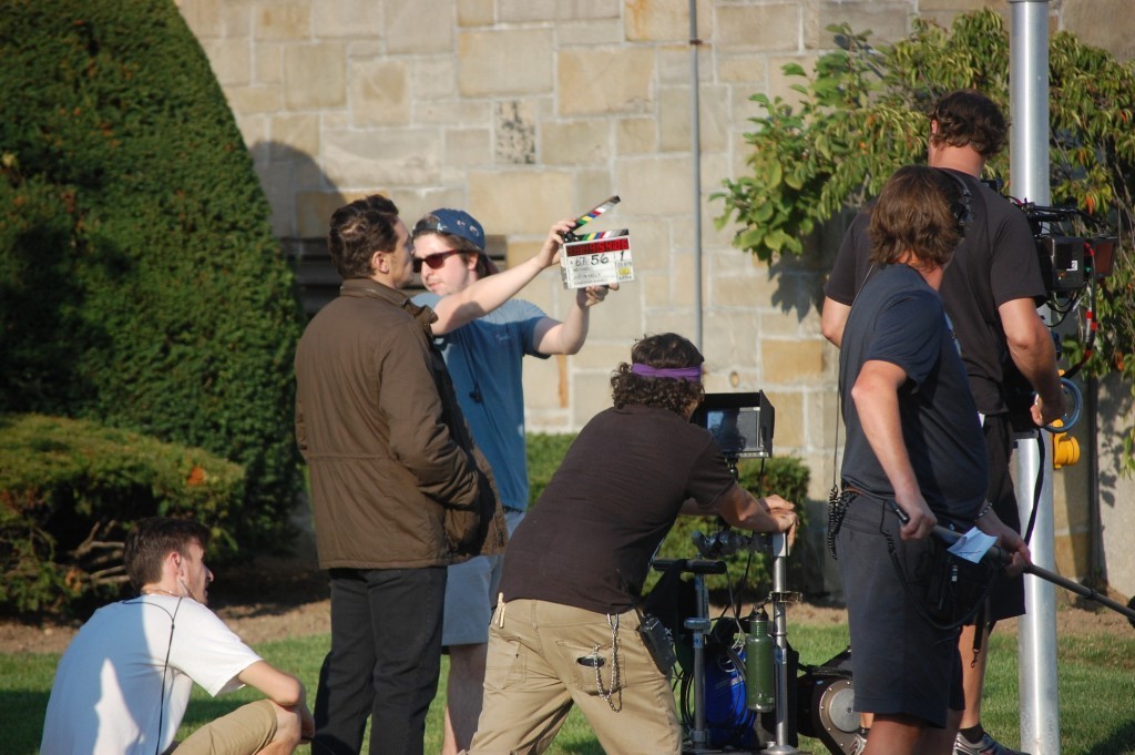 Actor James Franco, standing at left, prepared to shoot a scene for the upcoming film “Michael” outside St. Christopher’s Church in Baldwin last week.
