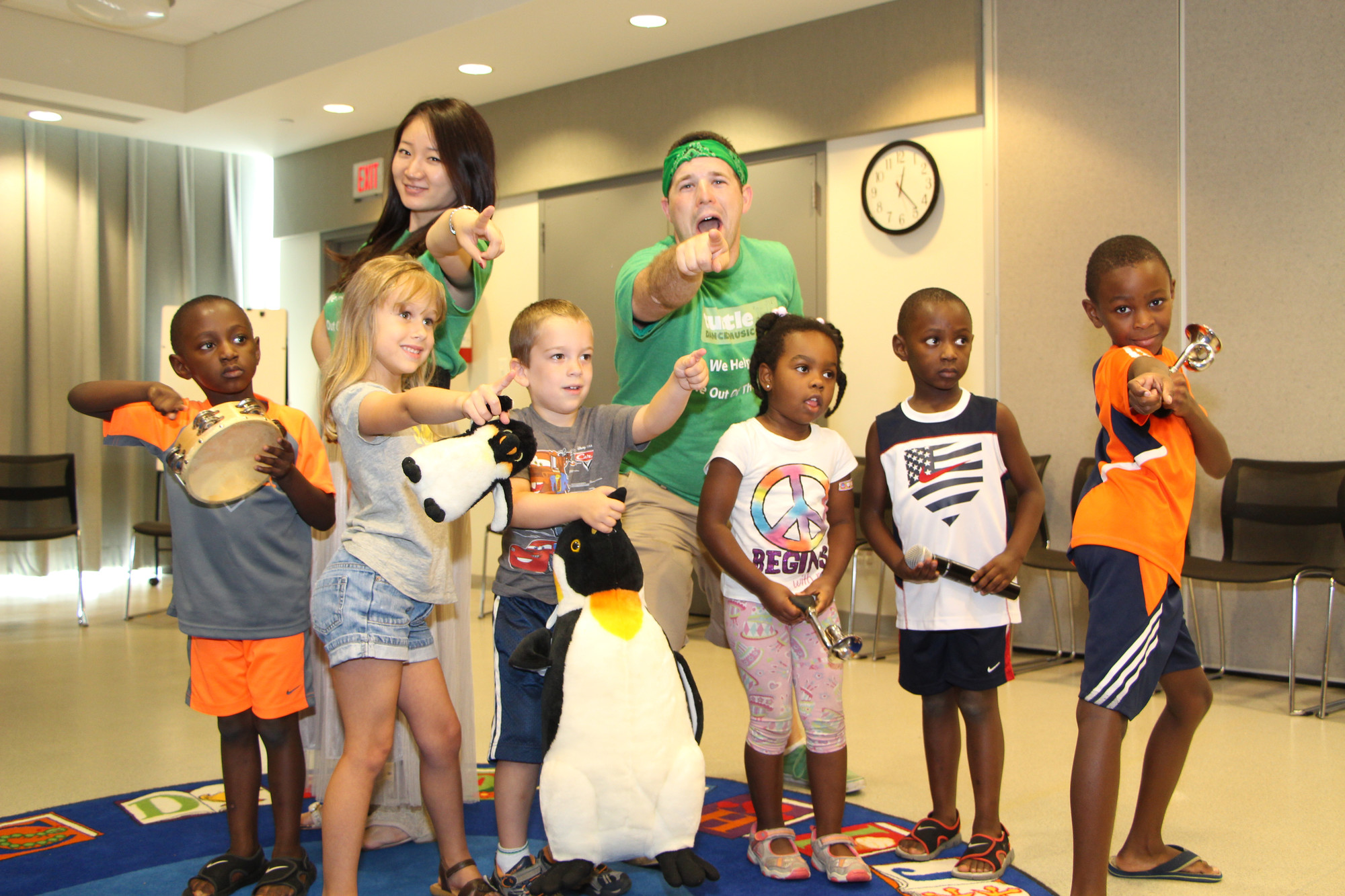 Shu Wang, back row left, and Matt Mazur, back row right, brought Turtle Dance Music to Baldwin Public Libary on Aug. 21 for Read-To-Me Club members to enjoy.