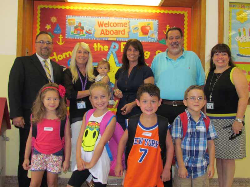 Continuing a yearly tradition, Famularo and Board of Education President Janet Goller, Kelly and Vice President Jay L.T. Breakstone joined Reinhard administrators and students on the first day of school