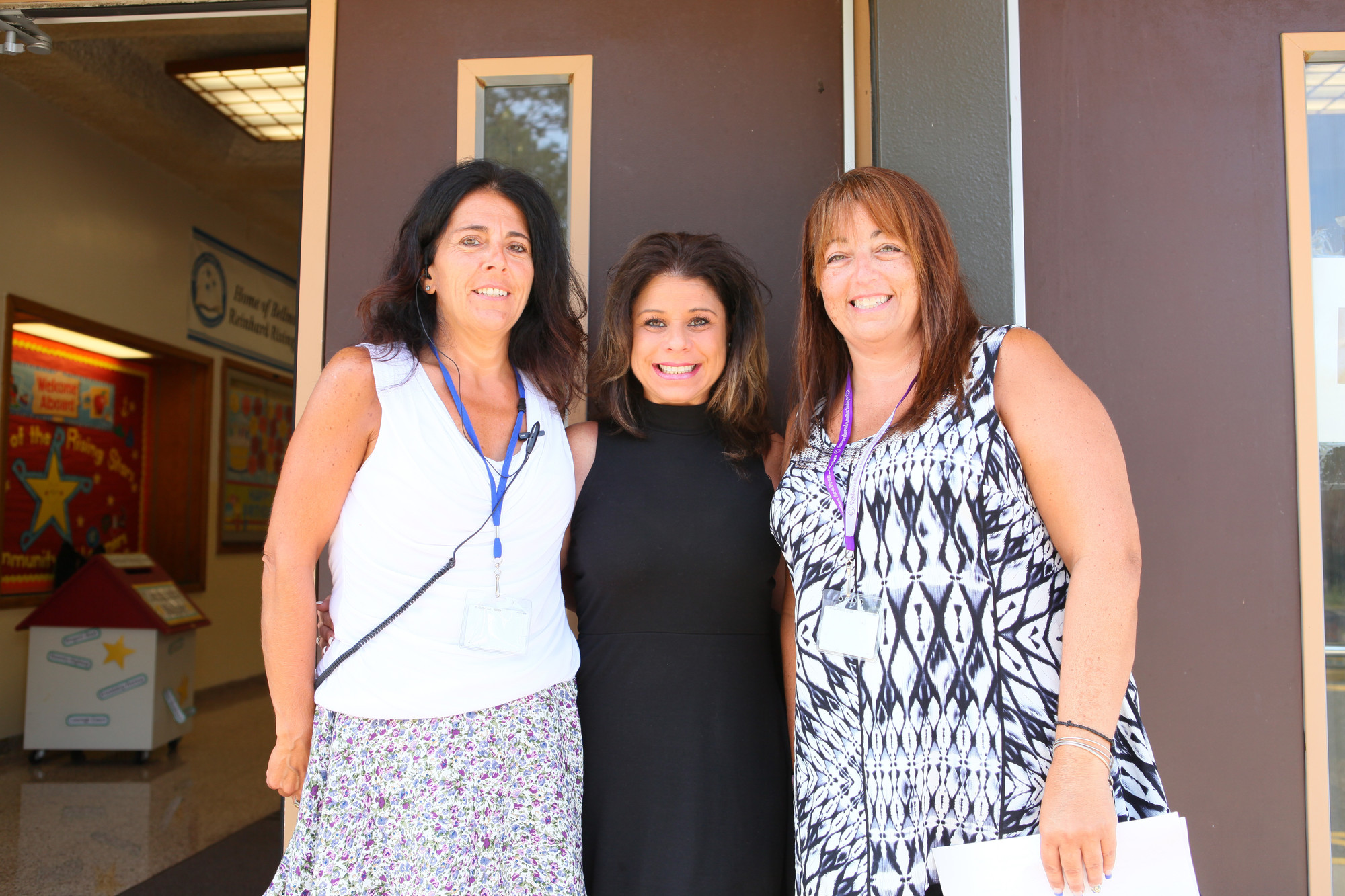 Staff members Lisa Esposito, Julie Hill and Gina Partland awaited the arrival of children on the first day of school.