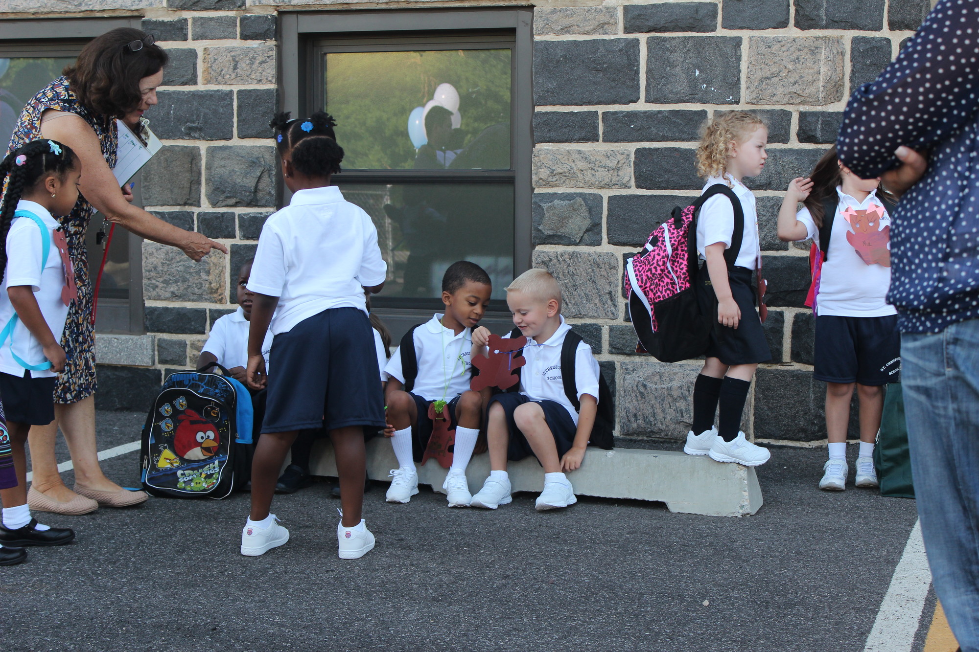 Kindergarten students looked over their name tags at St. Christopher School.