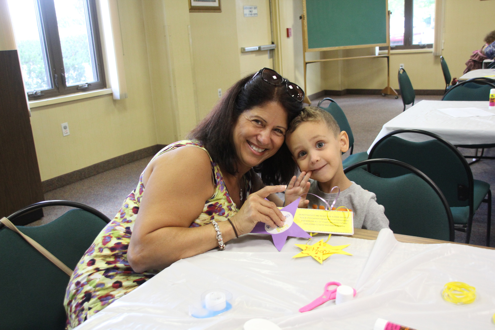 Lucy Gorsky helped her grandson, 3-year-old Ethan Lefkowitz, with crafts.