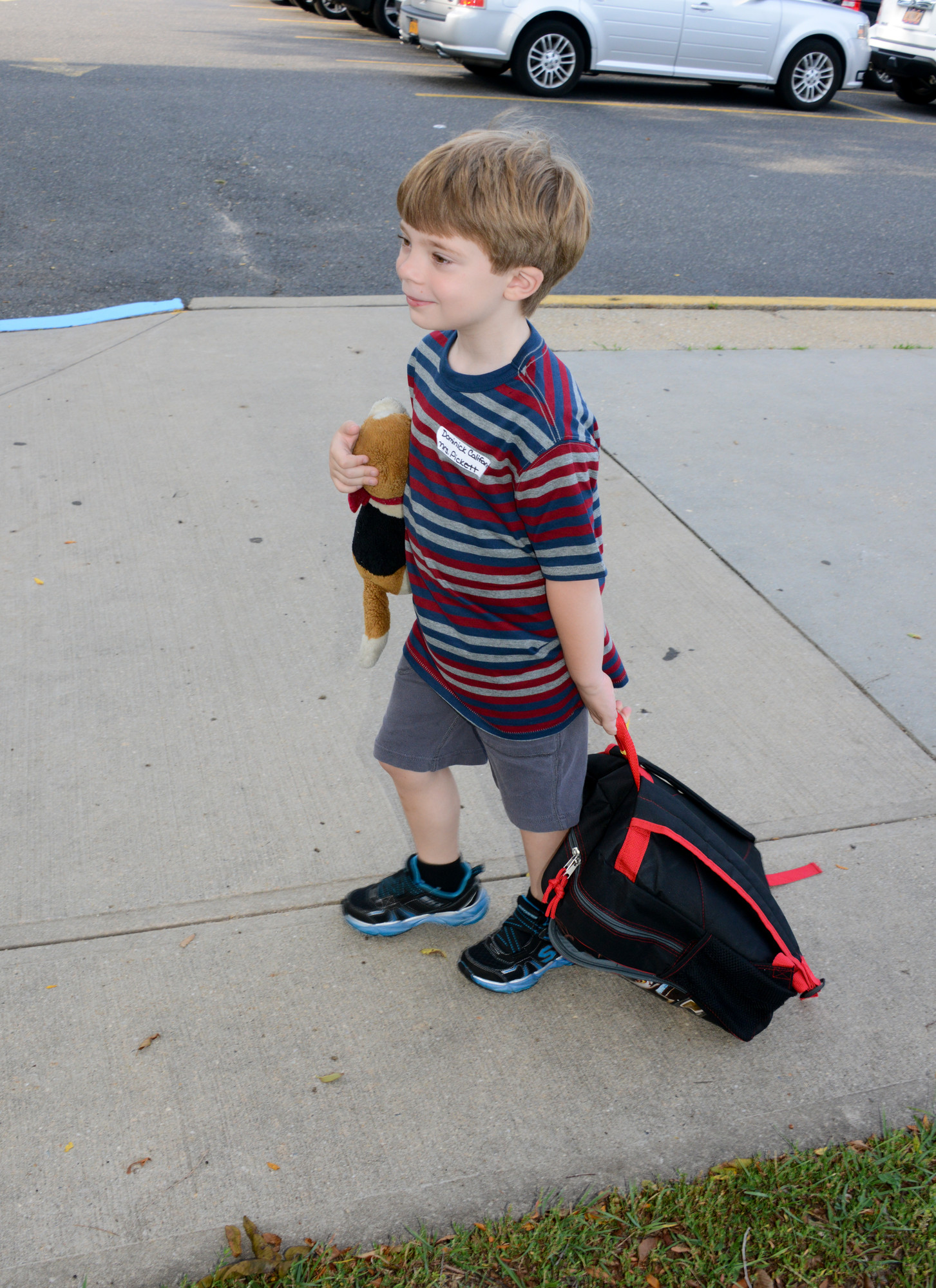 With his teddy bear and a new backpack Dominick Califano, 5, made his way to School No. 6 on September 2.