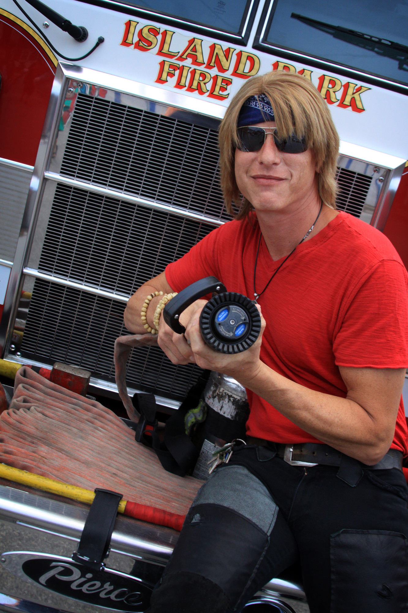 Steve Sage, lead singer of the Bon Jovi tribute band Bad Medicine, fooled around with a fire hose before the group performed on August 30.