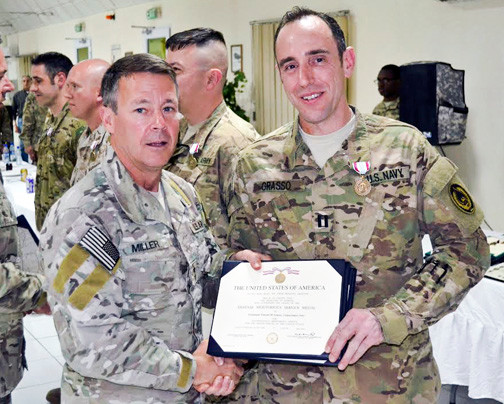 Vincent Grasso, right, was awarded the Defense meritorious Service medal in May for service in Afghanistan by Maj. Gen. Scott Miller, commander of the Special Operations Joint Task Force