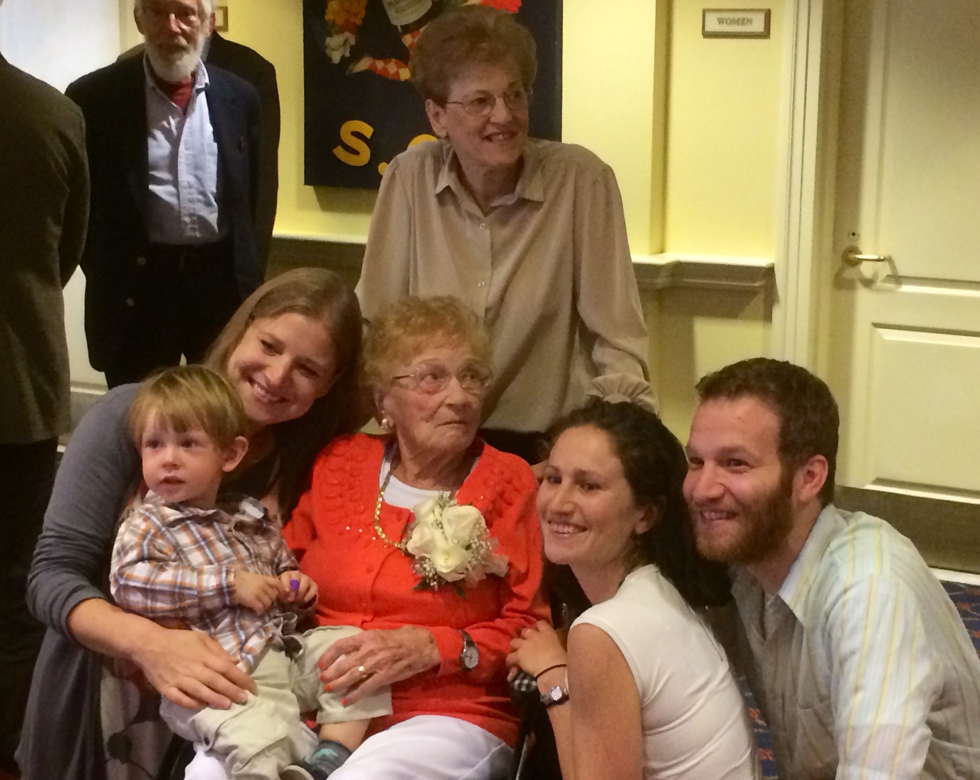 Shostak sits surrounded by her grandchildren, Susanna Post, far left, Sarah Shostak, near right, Adam Shostak, far right and her daughter, Lucy Shostak, back, and great grandson Ethan Post