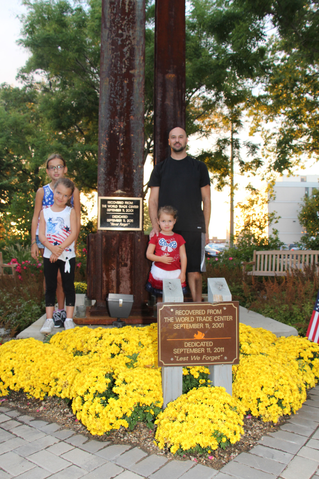 Brian Goldstein was working in a building next to the World Trade Center on 9/11, He escaped but he lost many of his friends that day.  He is pictured with his children: Emily, 11, left, Haley, 7, and Chloe, 3.