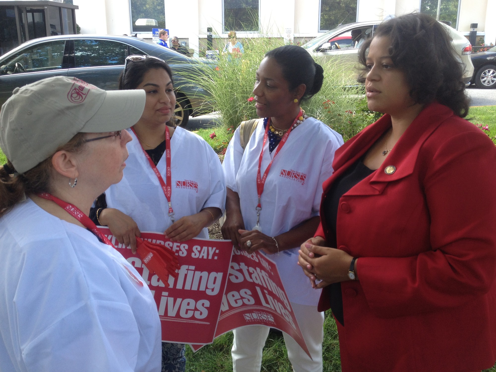 Assemblywoman Michelle Solages chatted with the protesting nurses