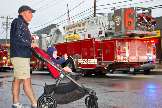 Tom Leninger, of Merrick, brought his 2-year-old grandson, James, of Wantagh, to the 6th Battalion Parade last Saturday evening, which was hosted by the Wantagh Fire Department. James was excited to see all the shiny red fire trucks. Story, more photos, page 13.