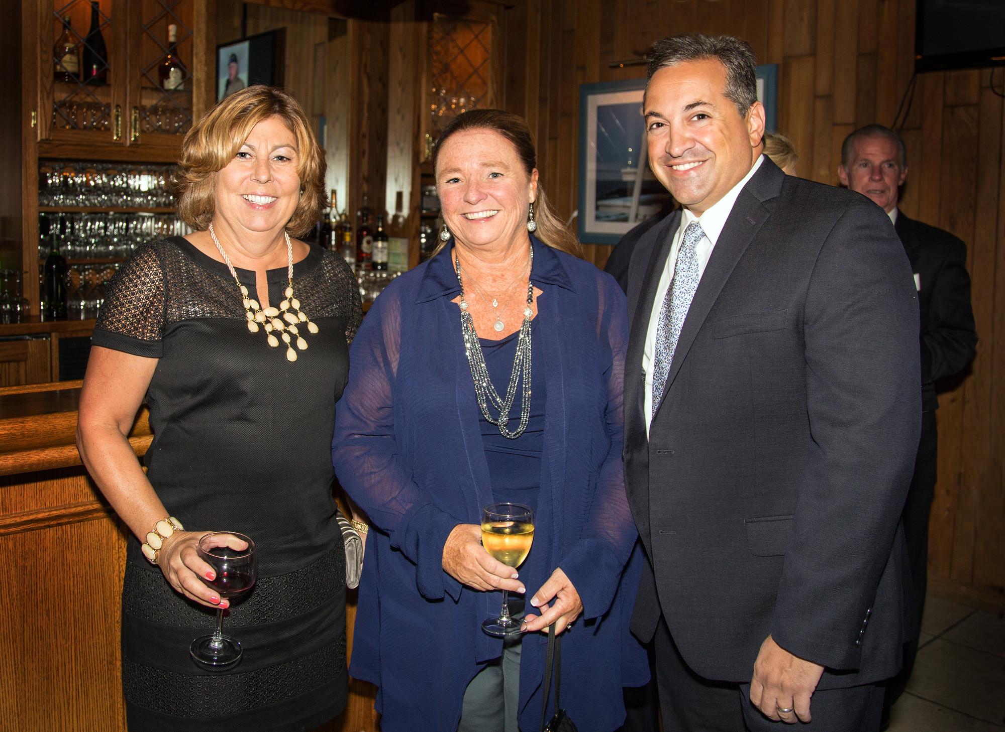 Family and friends of the honorees celebrated together during the cocktail hour. Pictured here are the mayor’s sister Rosemary Murray, Mayor Francis X. Murray’s wife Barbara and Village Trustee Michael Sepe.