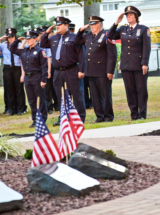 Auxiliary police saluted the flag.