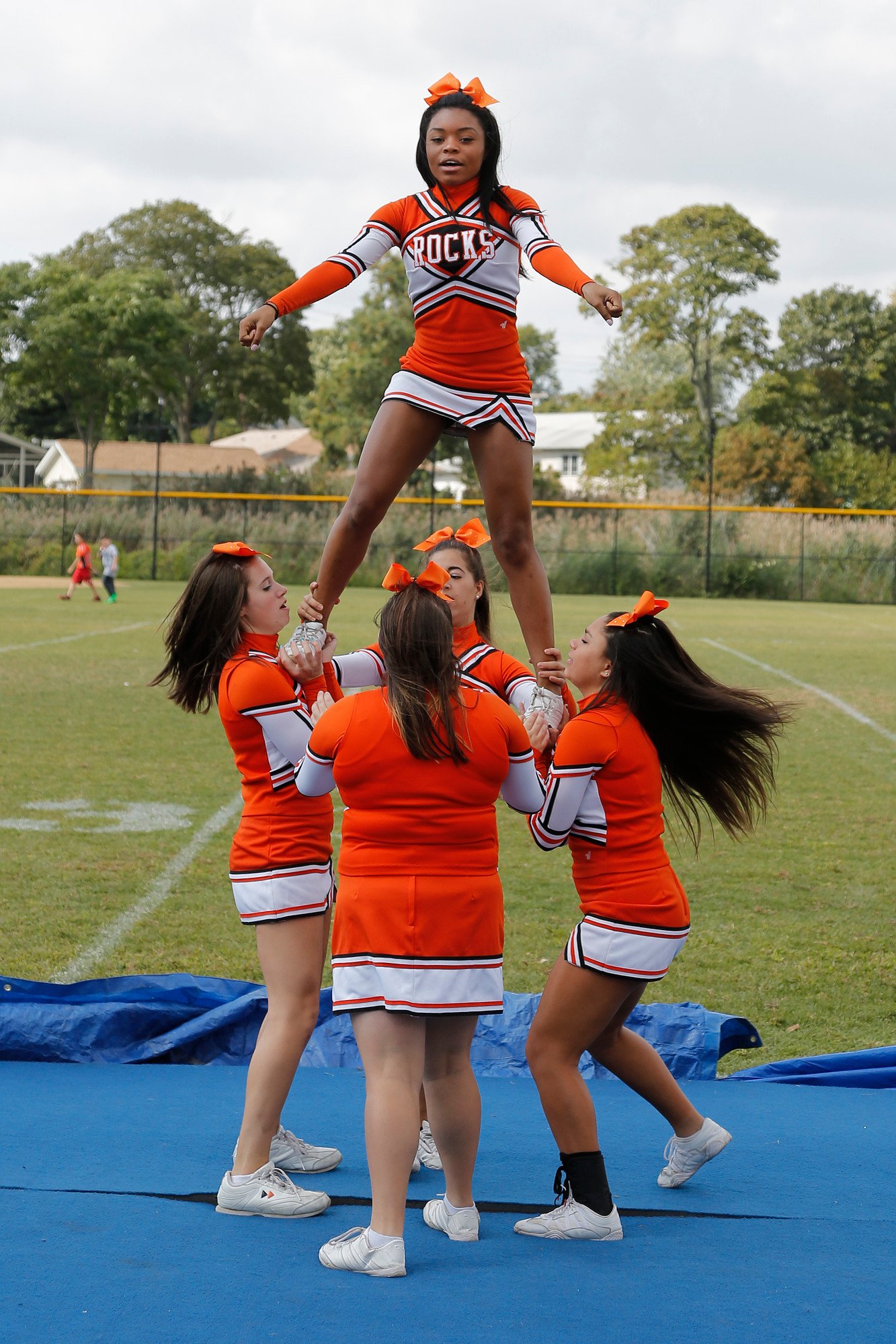 East Rockaway senior cheerleader and Captain Saskia Pilorqe and some of her squad perform during the game.