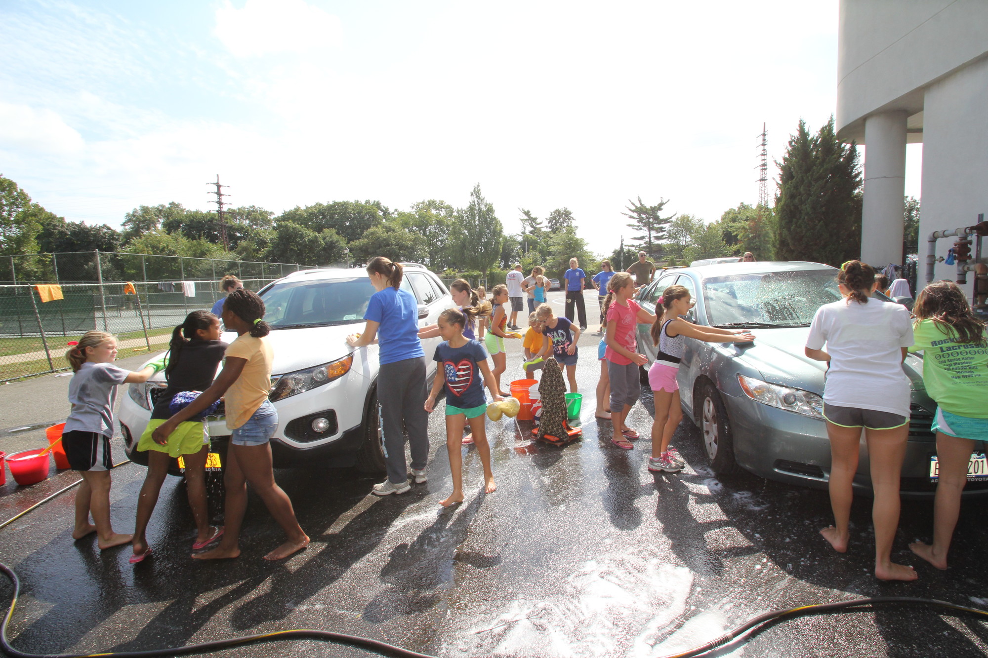 The Ultimate gymnastics team washed cars in the afternoon after their sister team, United Gymnastics, washed cars in the morning to help raise money for both their teams at the Rockville Centre Recreation center.