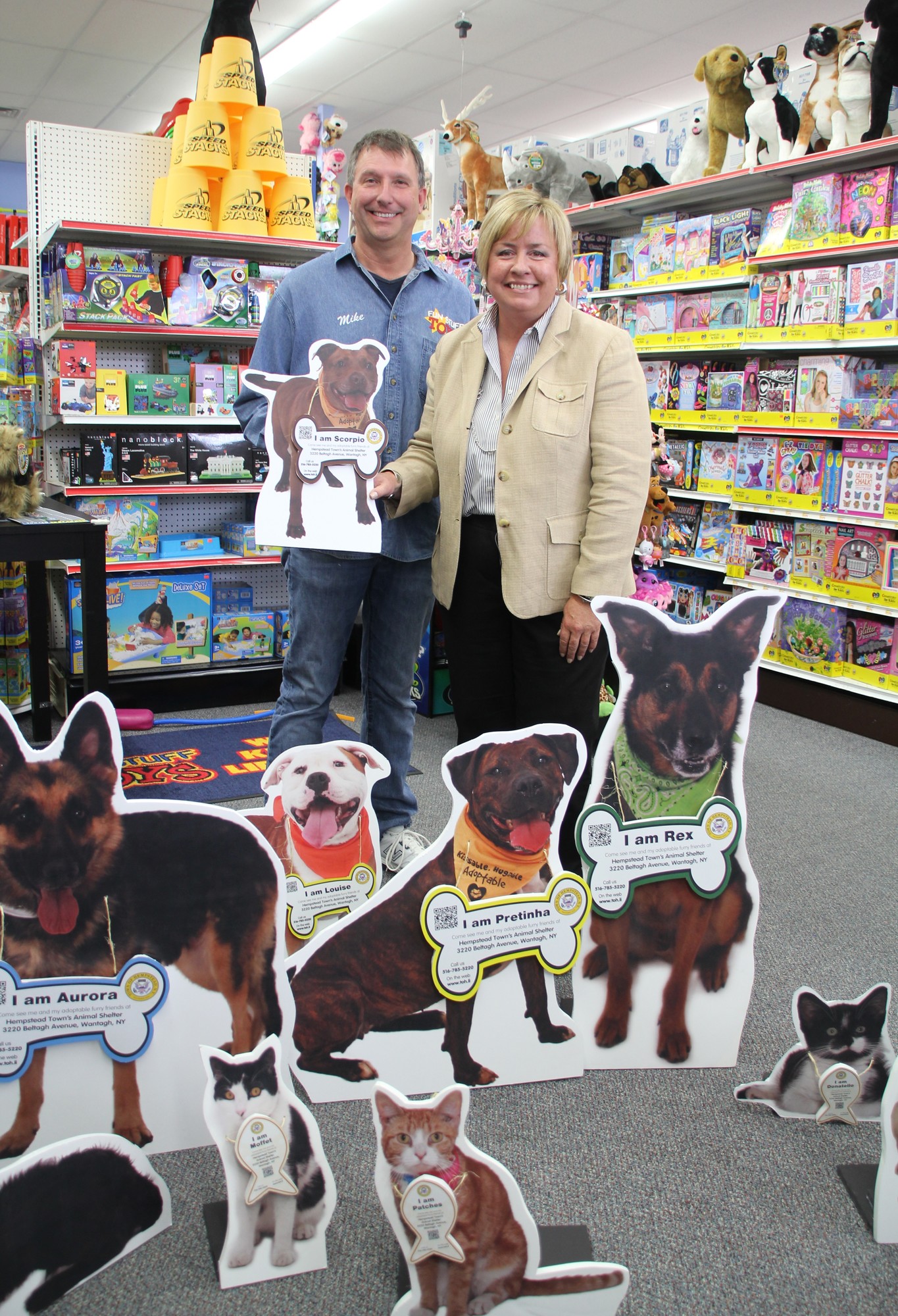 Business owner Mike Timko and Town Supervisor Kate Murray with some of the animal cutouts.