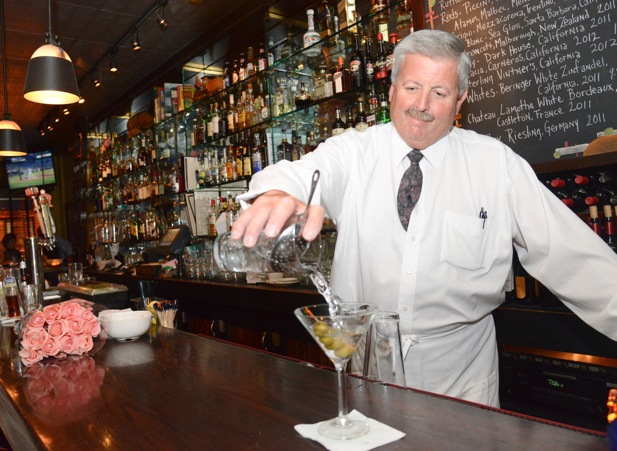 Bartender Manny Libow poured the new signature drink: the George Martini. Libow has been with the restaurant since it opened 25 years ago.