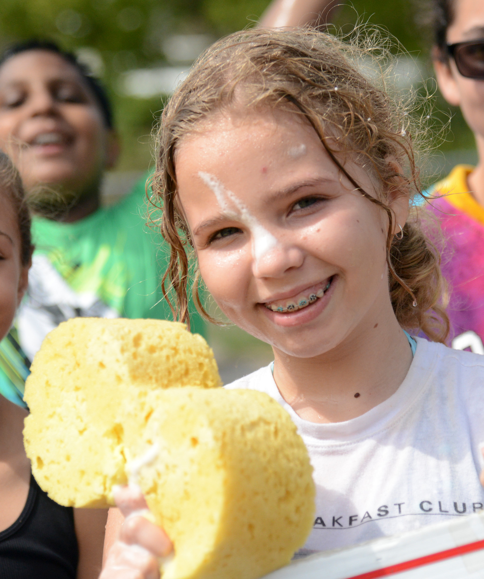 School No. 4 sixth-grader Claudia Galligan showed that washing cars can be good, clean fun.