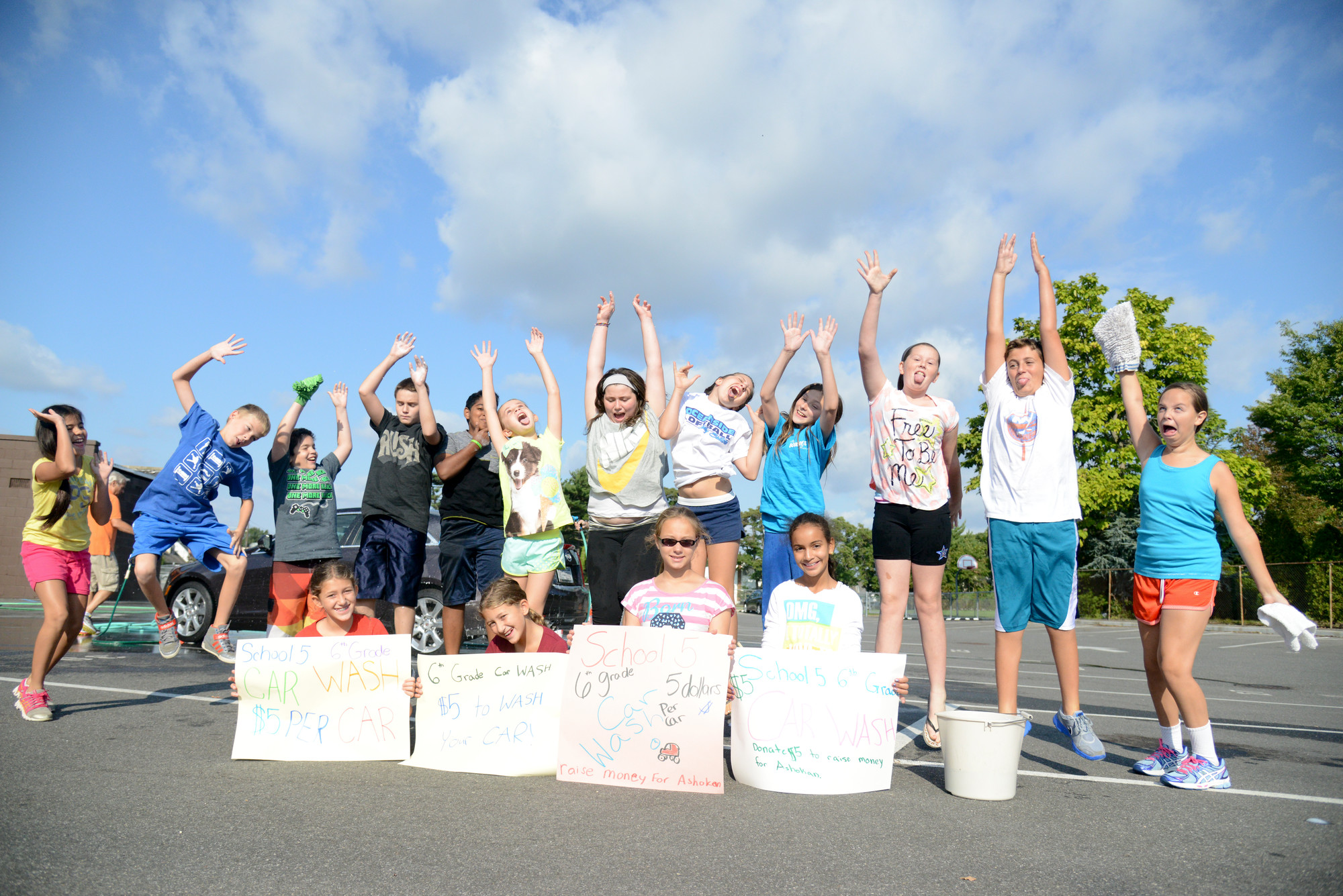 Sixth-Graders from School No. 5 celebrated a job well done after their car wash raised over $750 for their class trip.