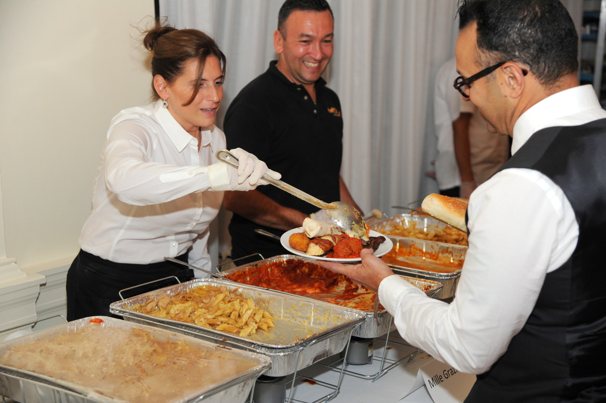 Joann and Jono Aronson, from Millie Grazie, served a variety of Italian foods at the East Meadow Chamber of Commerce Culinary Delights fundraiser on Monday.