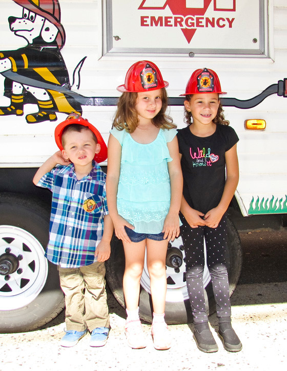 Jacob Lebron, 2, Isabella Lebron, 5, and Emily LaManna, 5, each of Valley Stream, learned the importance of dialing 911 in case of an emergency