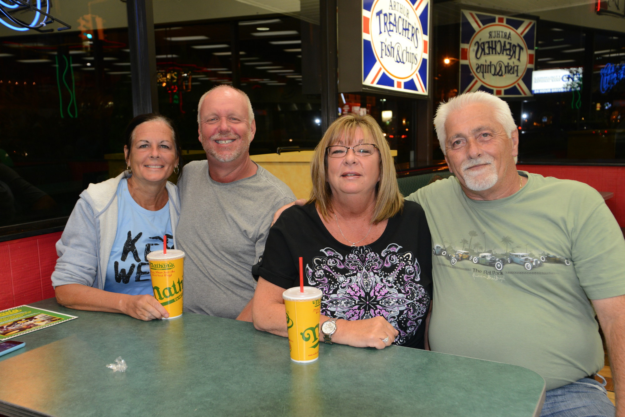 Double dating at Nathan’s, just as they have since 1978, Diane and Glen China, left, and Andrea and Greg Johnson said goodbye to one of their favorite hangouts.