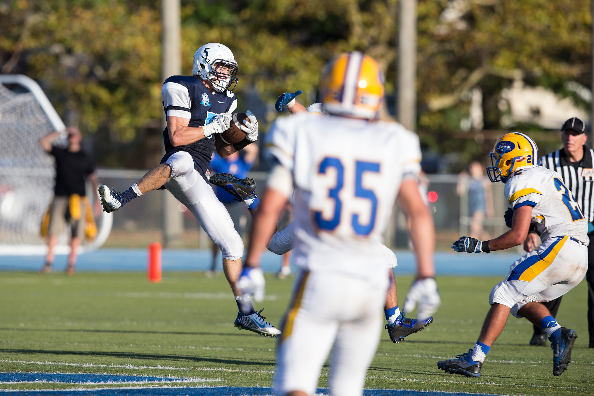 Senior receiver Mike Checco went up high to snare a pass from Vincent Guarino. The pair hooked up for a 27-yard touchdown pass in the fourth quarter.