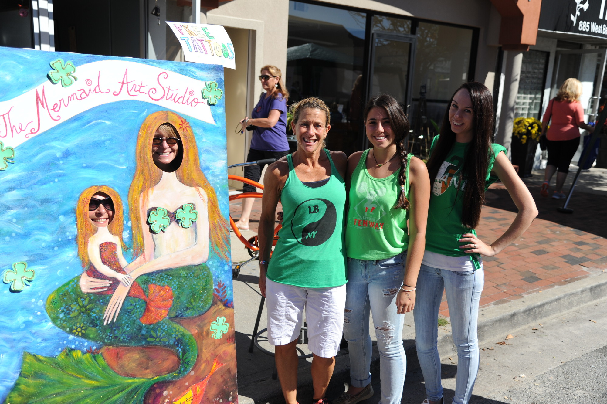 The Mermaid Studio’s Laura Brykowski, left, Denise Collins and Liz Nachman were among the thousands who turned out for the Irish Day parade.