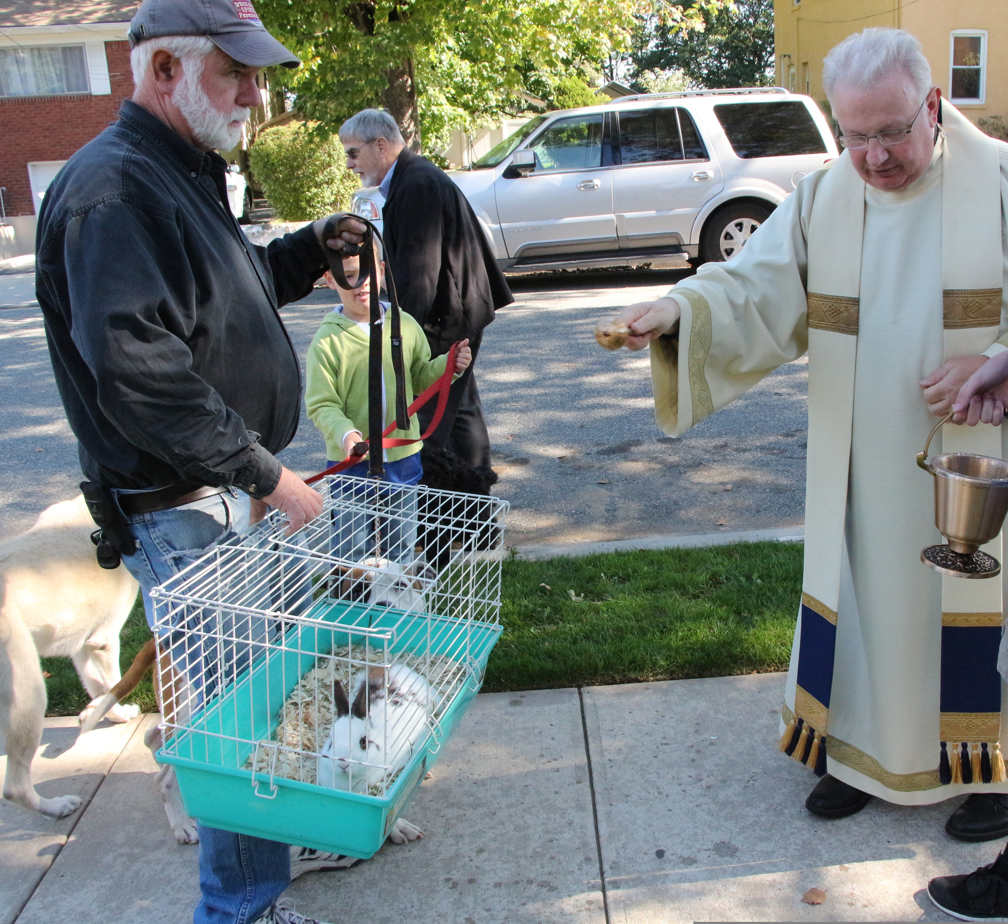 William Tait and Liam Kirwan had their bunny Thumper and their dog Sandy blessed on the nice
fall morning.