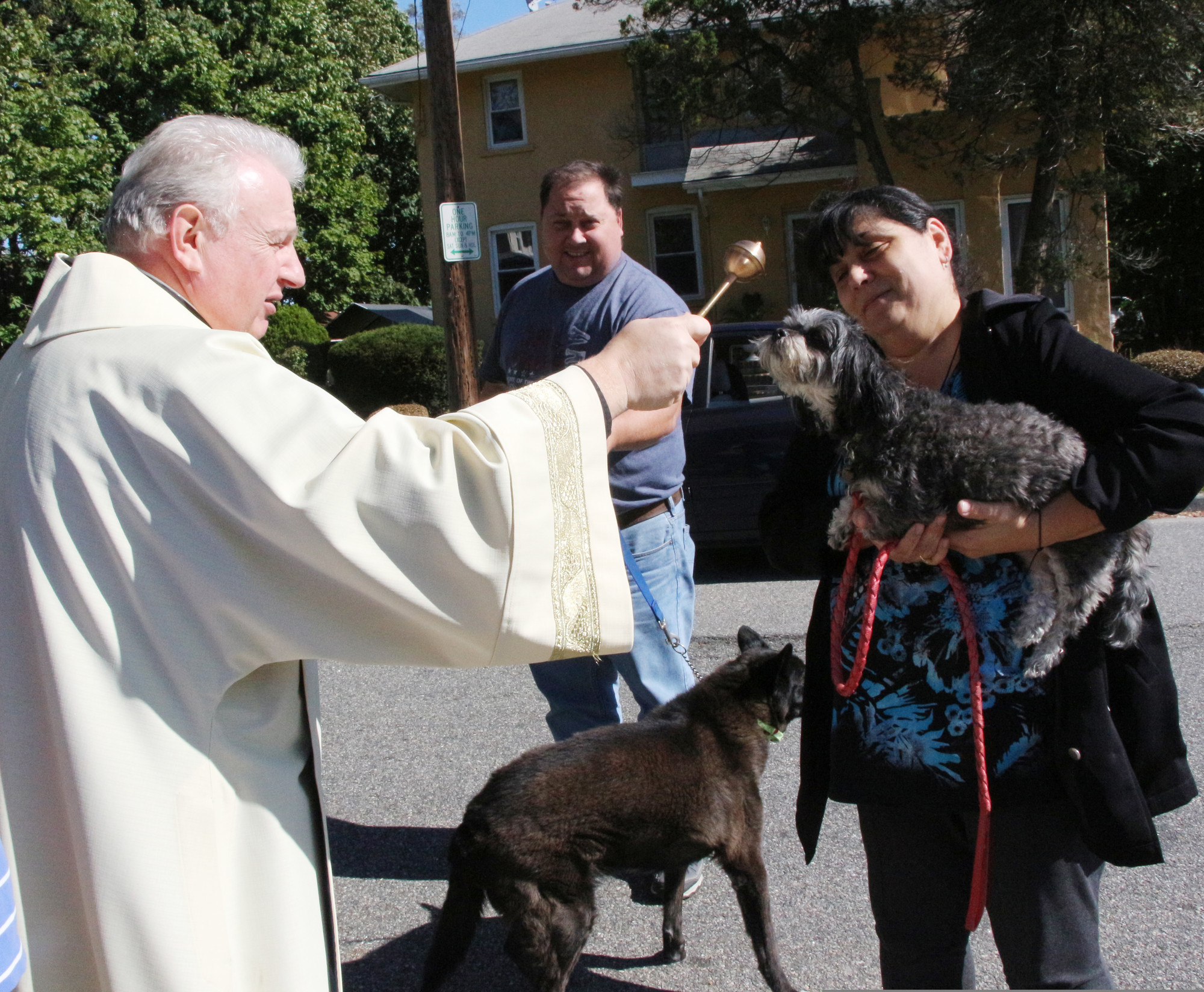 Msgr. Steven Camp blessed the Moore’s pets, Lexi and Shadow, on Oct. 5.