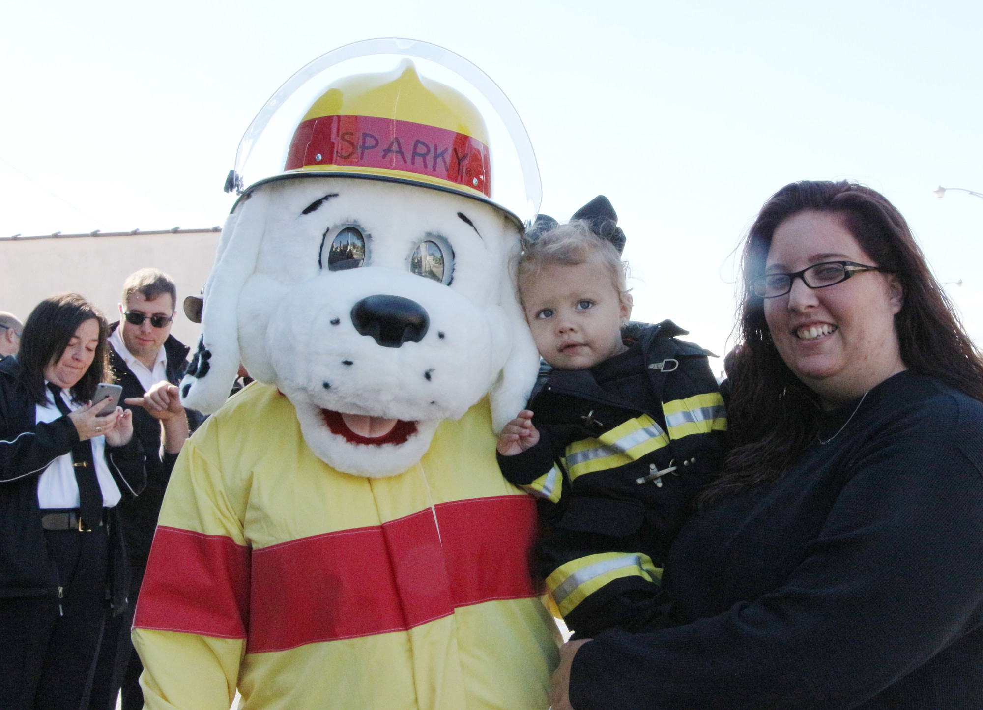 Sparky, the BFD’s mascot, hung out with Madison Rivera Hagan, 2, and her mom Julia.