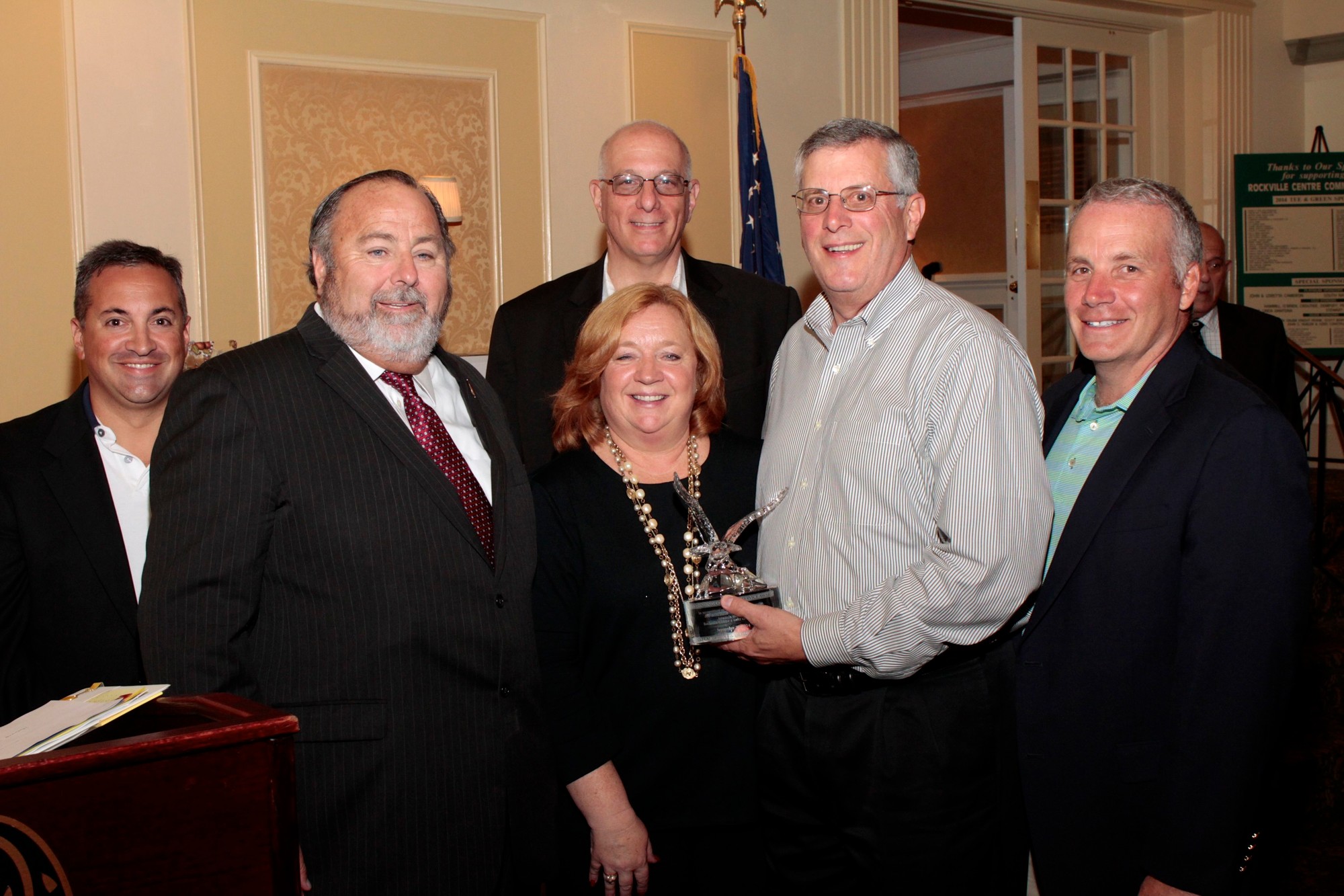 The Village Board of Trustees Congratulated former Village Trustee Jack Matthews, second from right, who won the Outstanding Community Service Award.