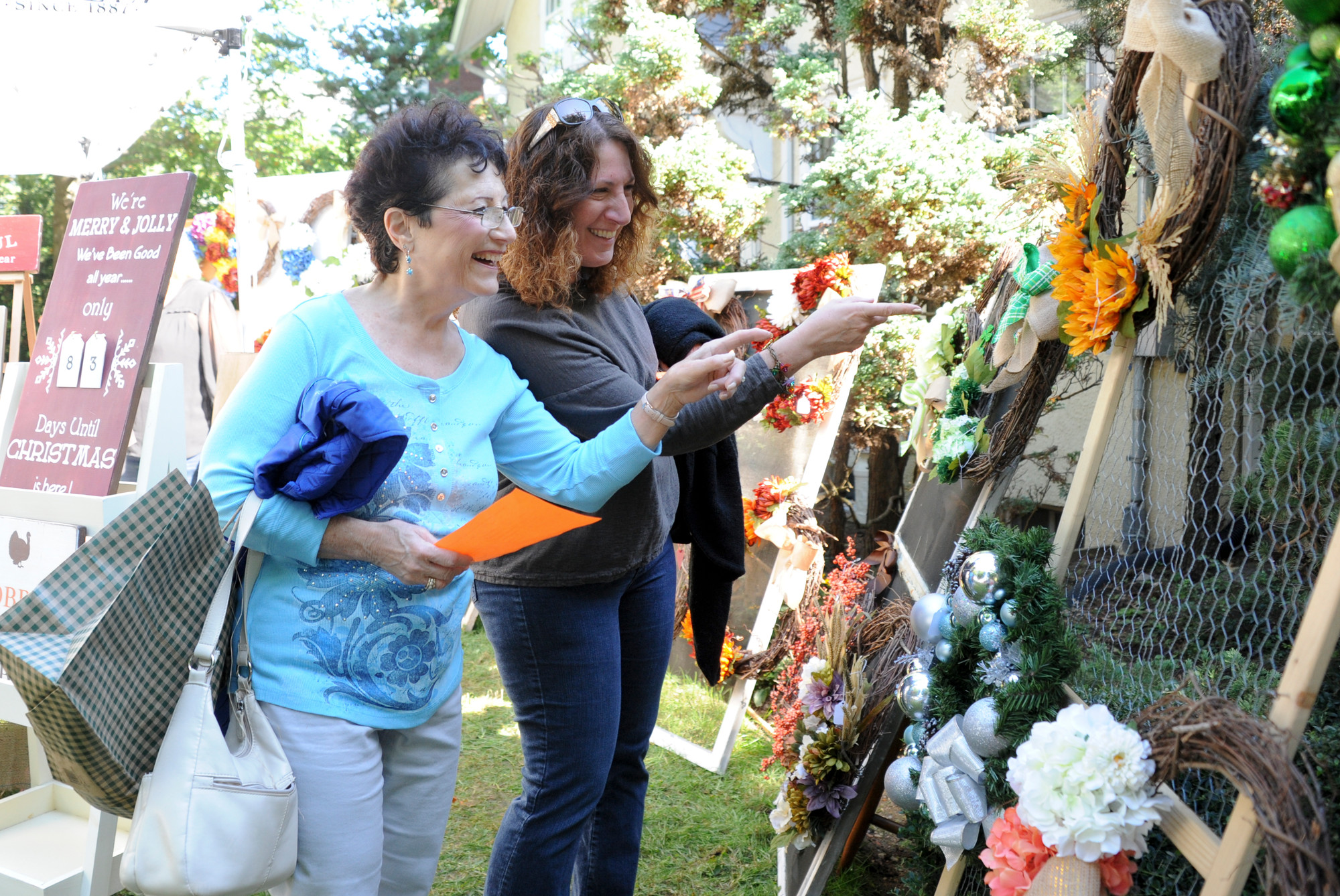 Angela Leonardi and Toni Holder picked out holiday wreaths at the St. Agnes Mothers’ Club Garden Potpourri on Oct. 3.