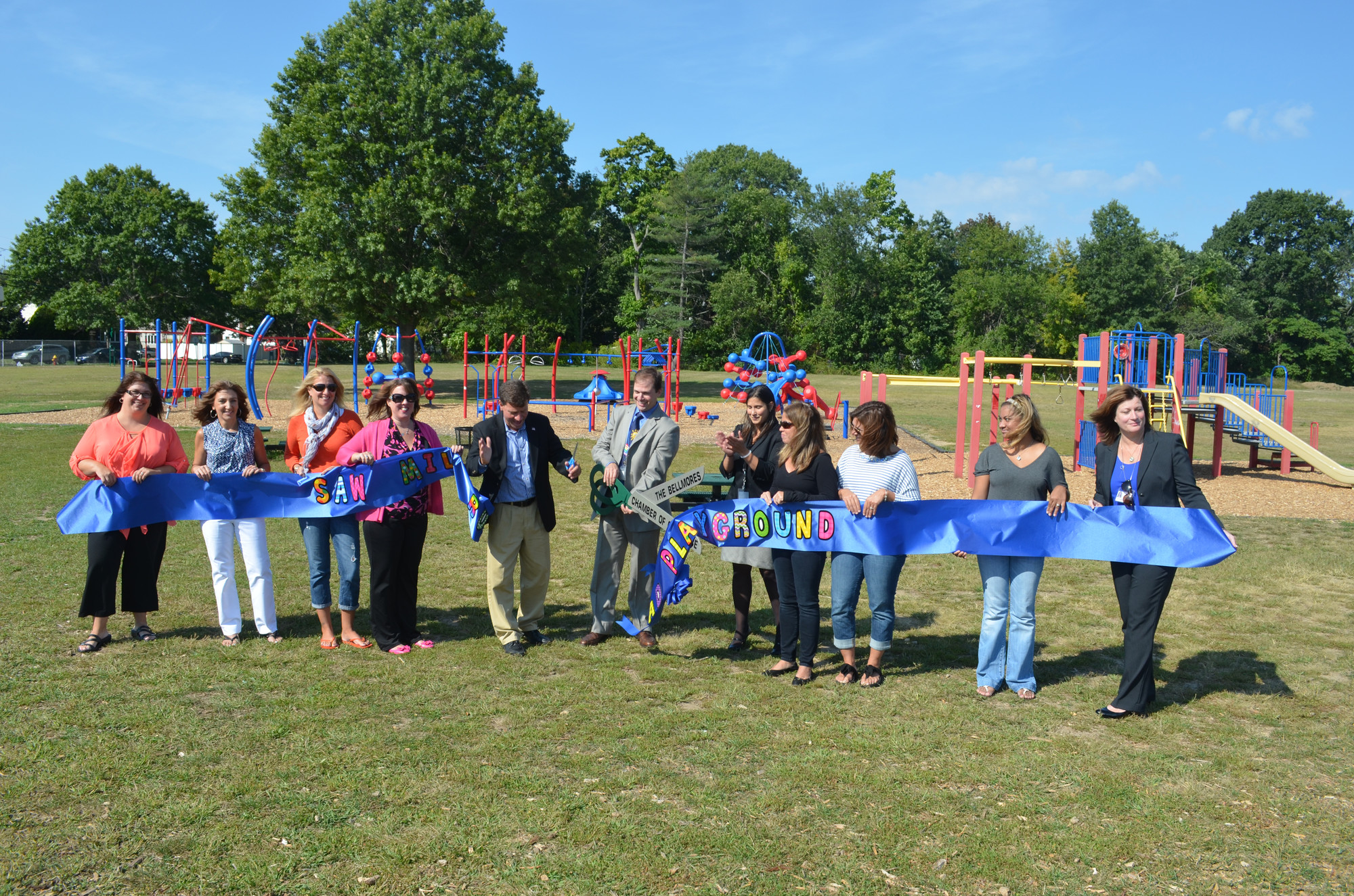 North Bellmore school officials and Saw Mill Road parents cut the ribbon at the new playground