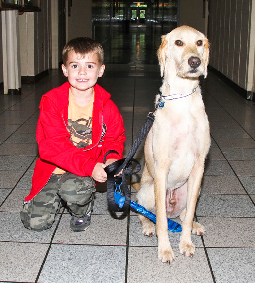 Tanner was on his best behavior beside his master, 5-year-old Nicholas Timman.