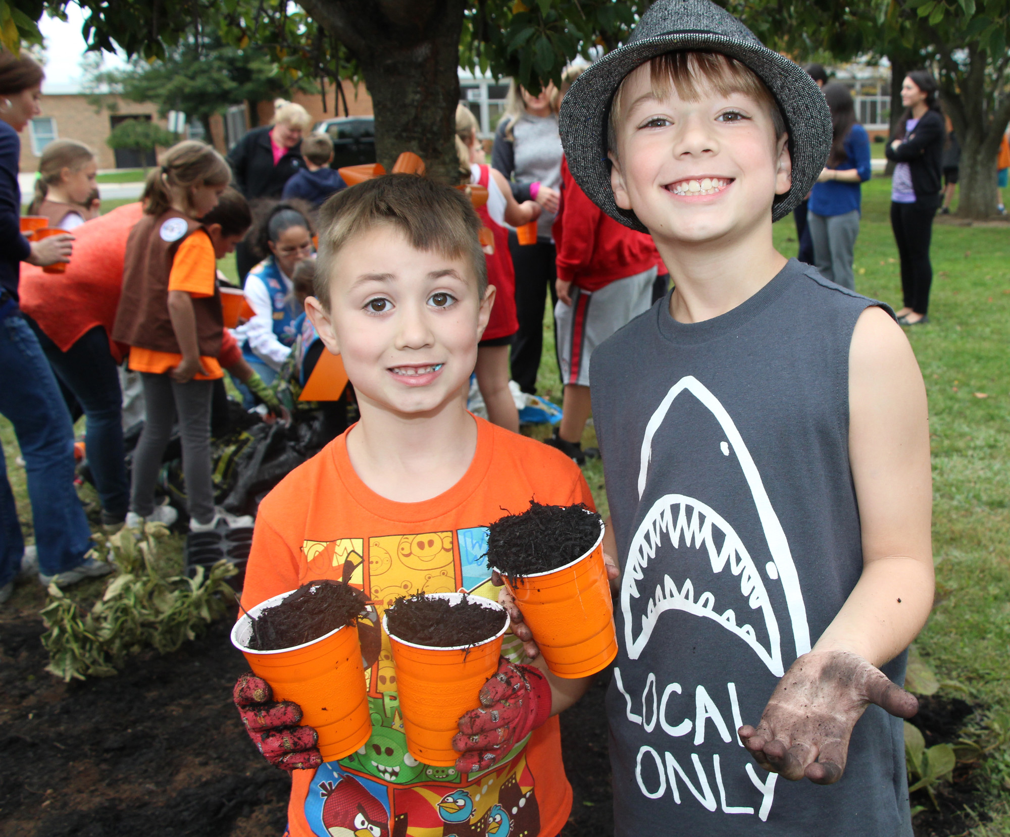 Ryan Zsamboky, 6, and his older brother Ryan, 8, had no problem getting their hands dirty.