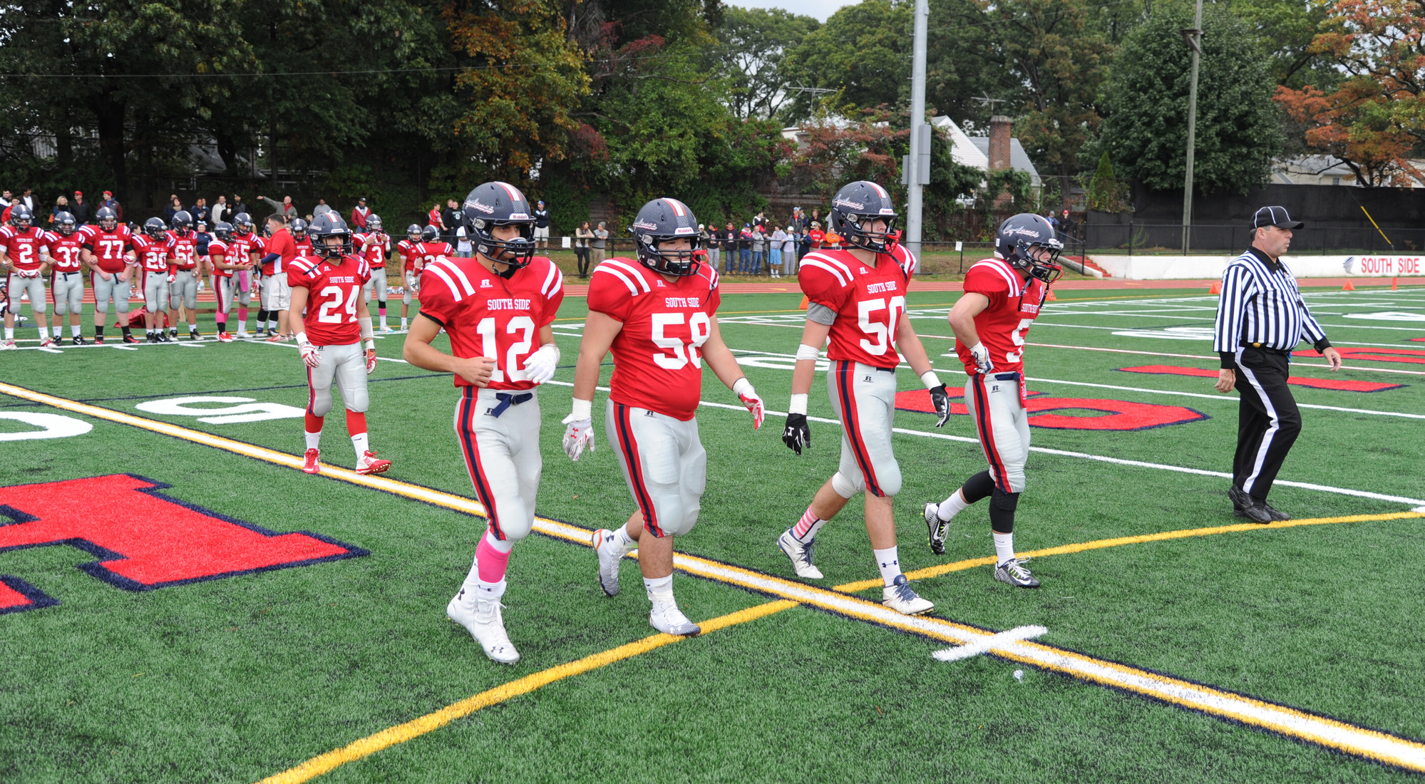 Nick DiMare, left, Jason Dantona, Kyle McWalters and Stephen Parker led the Cyclones out for the opening game against Division.