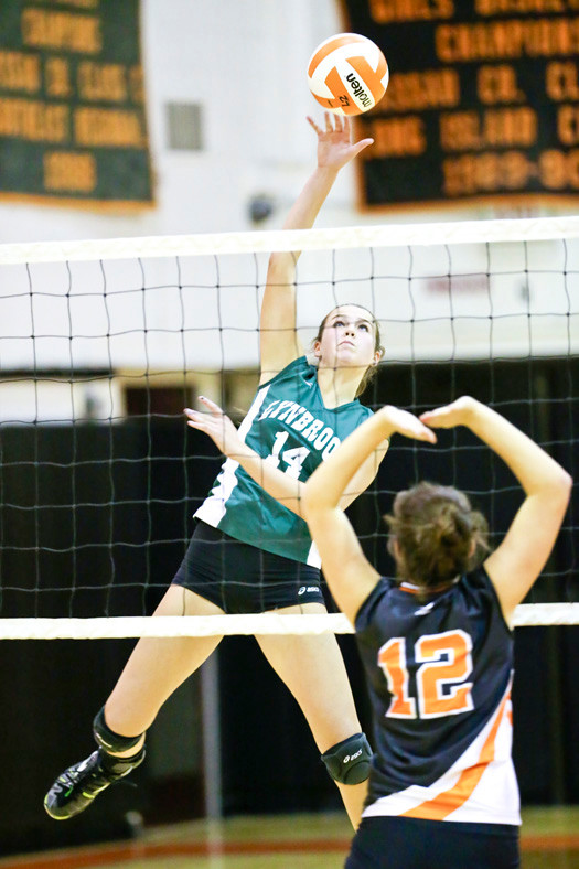 Lynbrook's Georgia Krendel delivered a smash during last Friday's three-game sweep of East Rockaway.