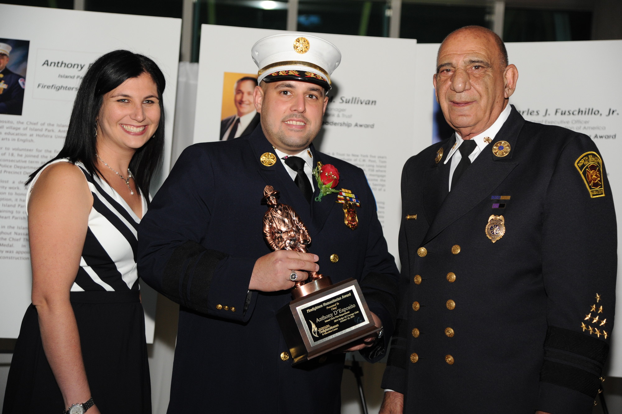 Anthony D’Esposito was presented with the Firefighter Humanitarian Award by executive director of the Nassau County Firefighters Museum Alana Petrocelli, left, and Angelo Catalano, president of the board.