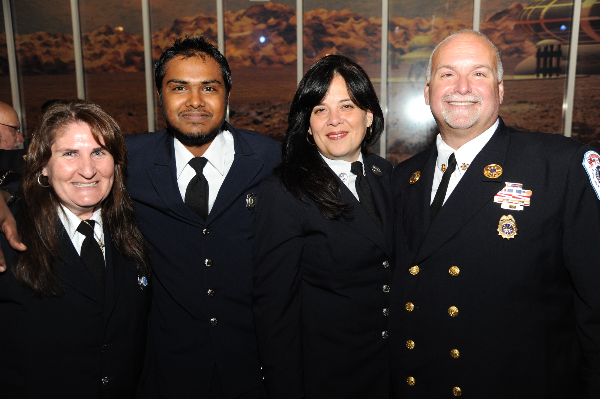 Members of the Island Park Fire Department celebrated the evening with their chief. From left, Susan Peterson, Shiv Hardewar, Margaret Rodriguez and Steve Ruscio.