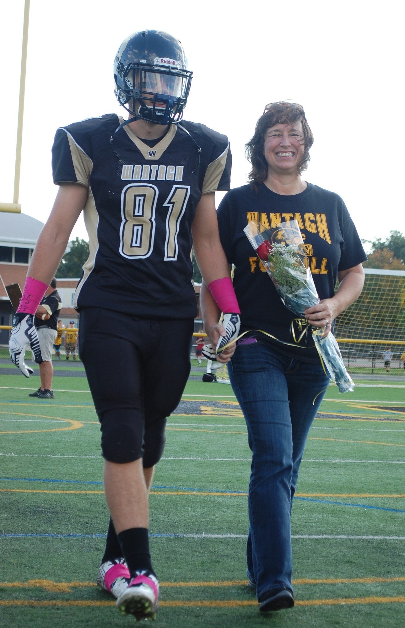 Senior George Williams was escorted onto the field by his mother, Gail.