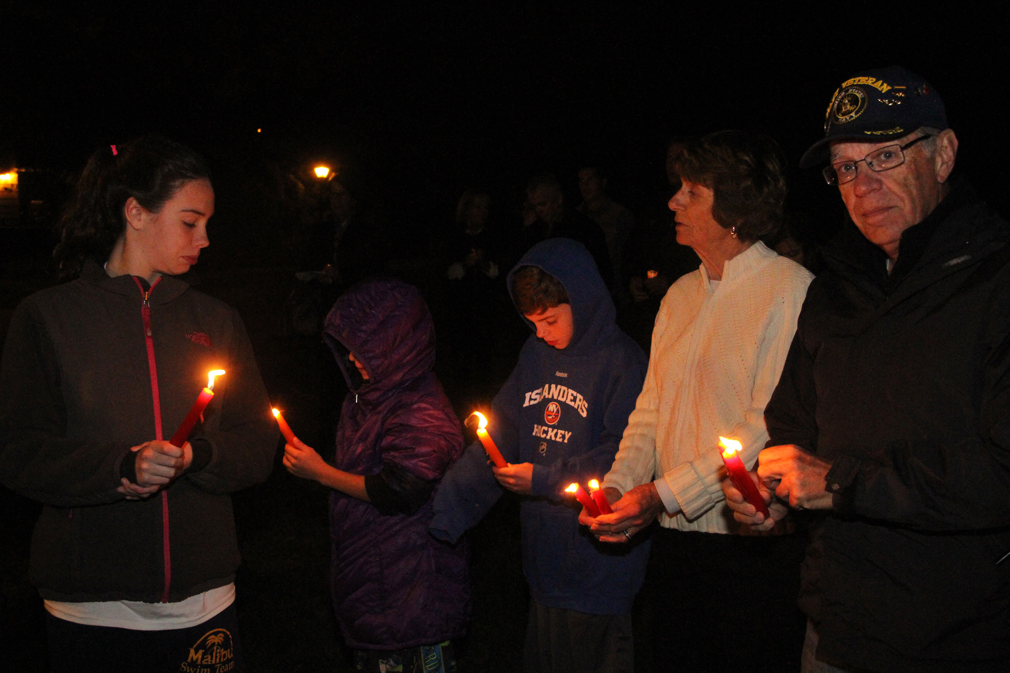 The Rinn family lit candles in memory of those from Rockville Centre who died on Sept. 11.
