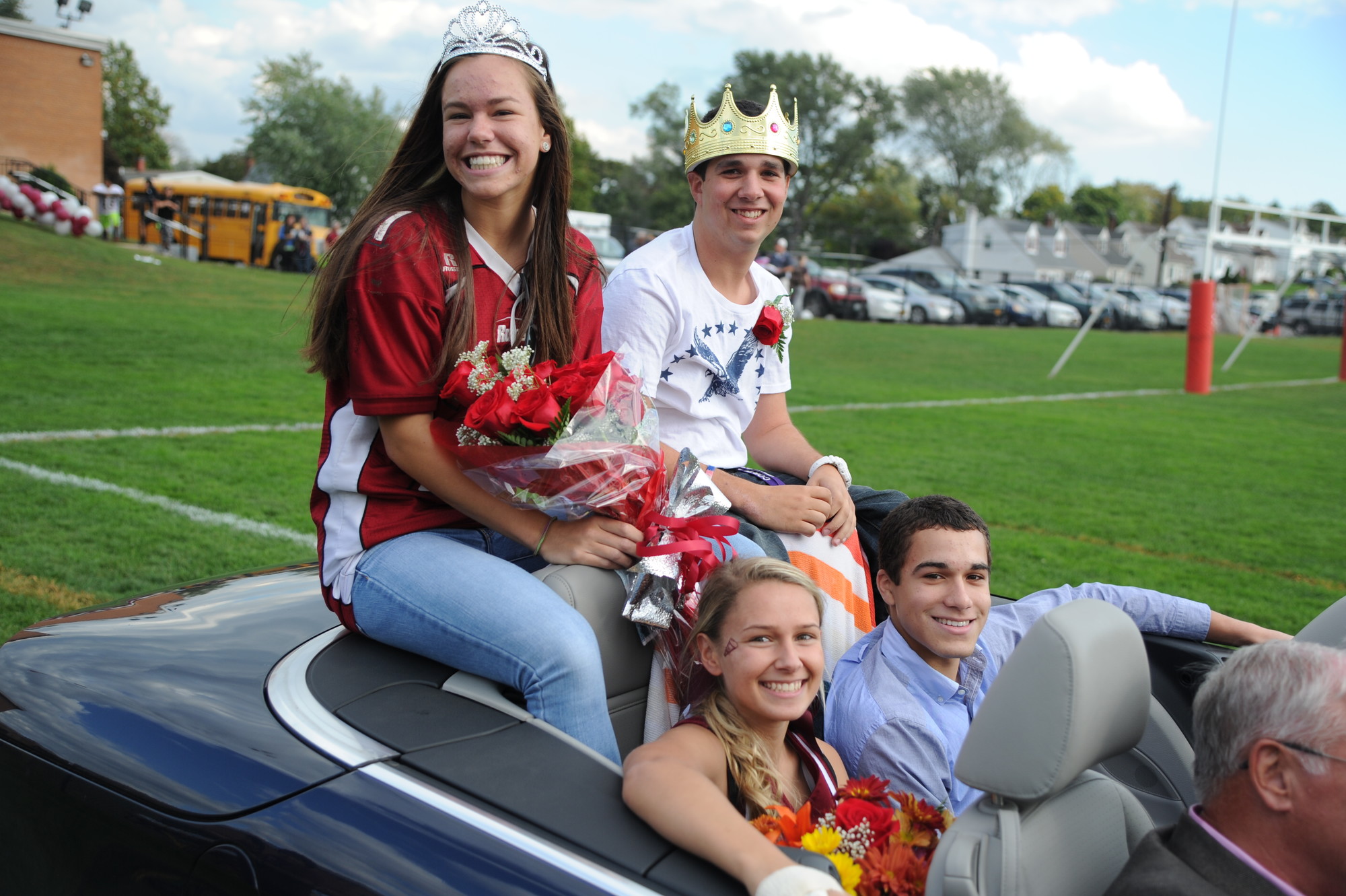 Lauren Bower and David Langsam, Clarke’s Homecoming Queen and King, sat atop a blue convertible, joined by Alexis Stobe and Brandon Garcia, the Princess and Prince, at the school’s homecoming parade last Saturday.
