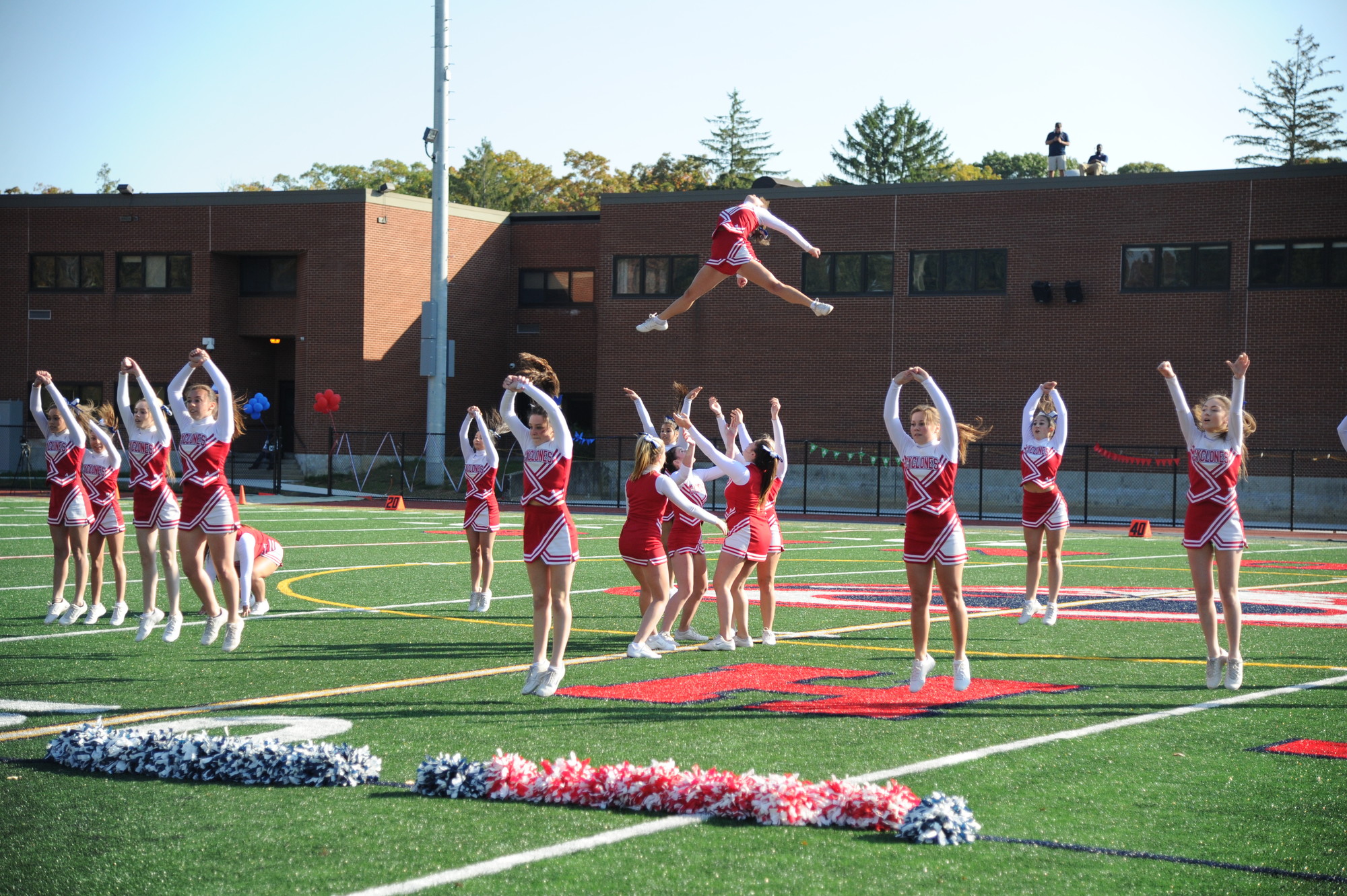 The school’s cheerleaders showed off their impressive skills during halftime.