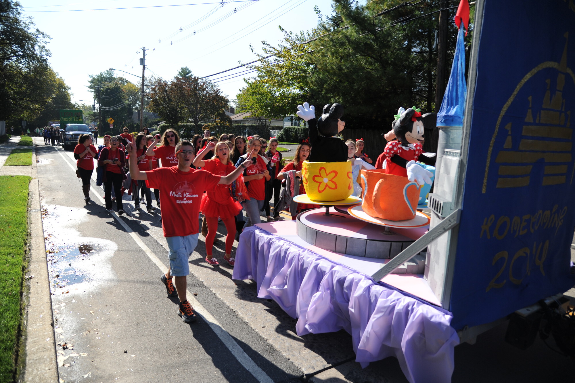 South Side High School seniors marched behind their Disney World float during the Homecoming parade.
