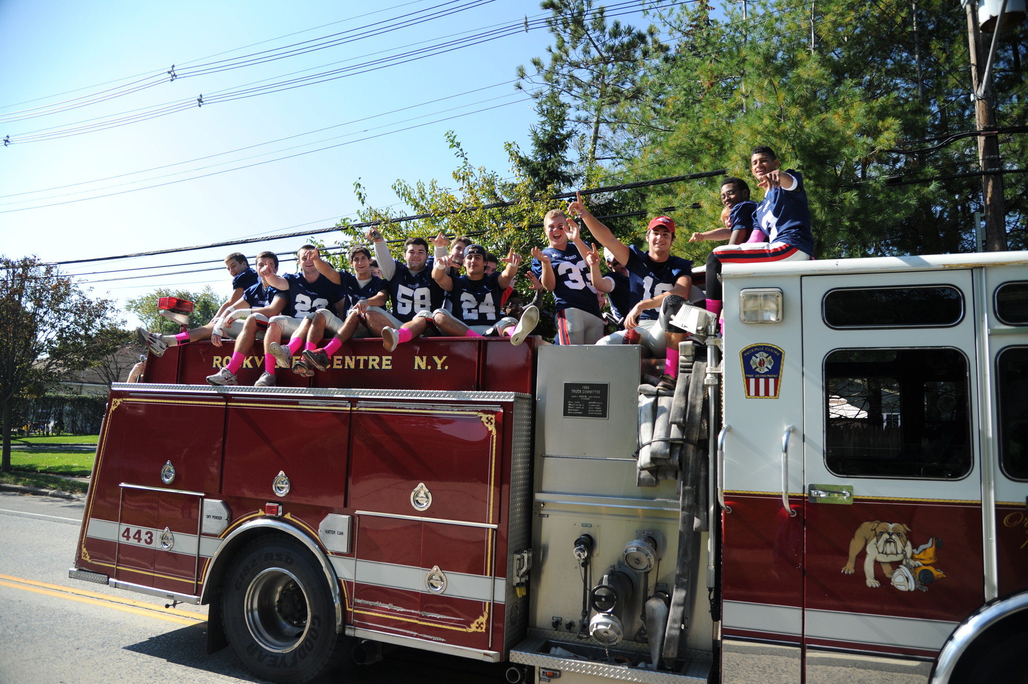 Before they rode to victory, the football team rode to the game atop a Rockville Centre Fire Department truck.
