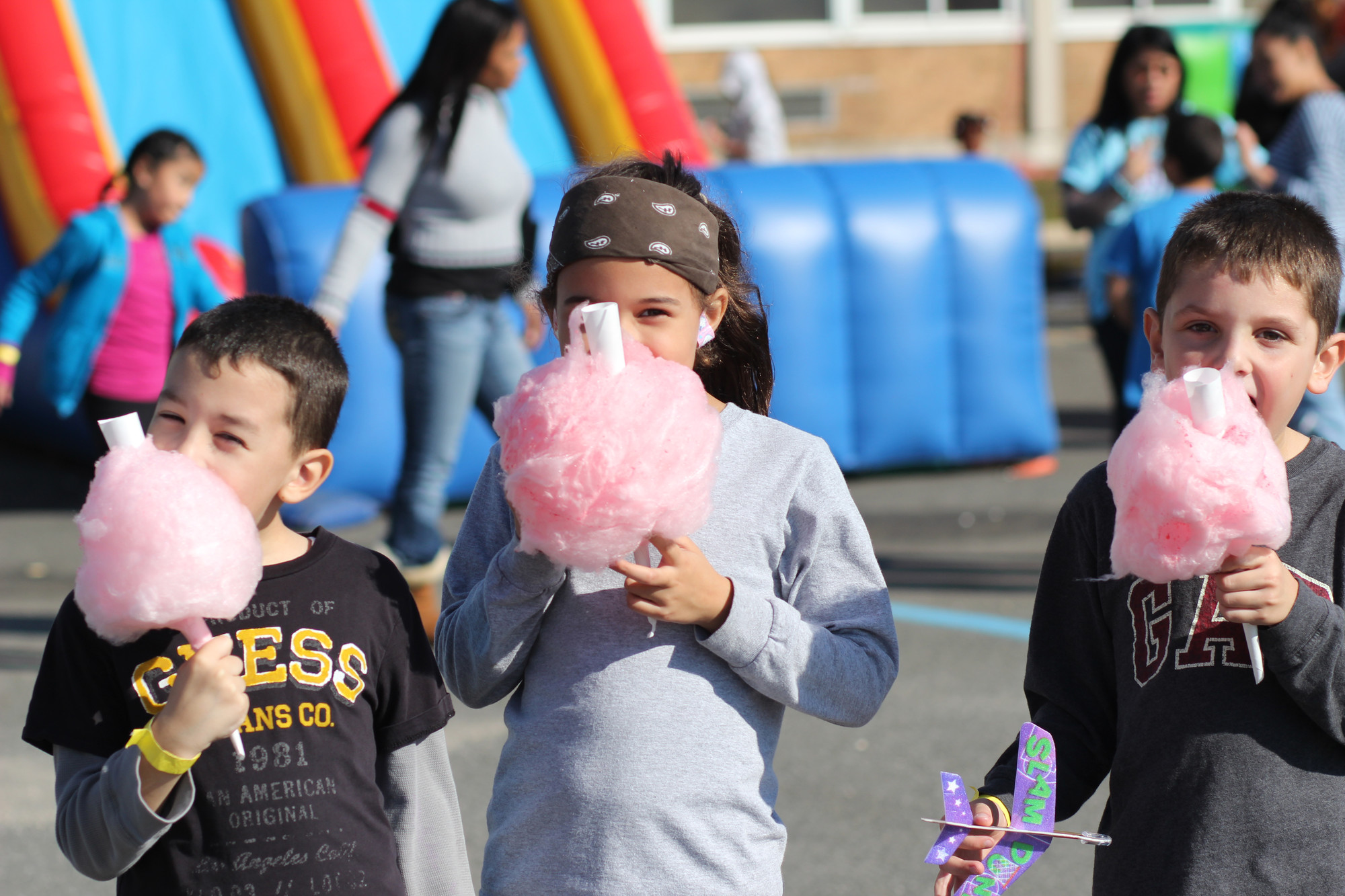 JR Heredia, 6, Melina Heredia, 7, and Aidan Ryan, 6, enjoyed their cotton candy.