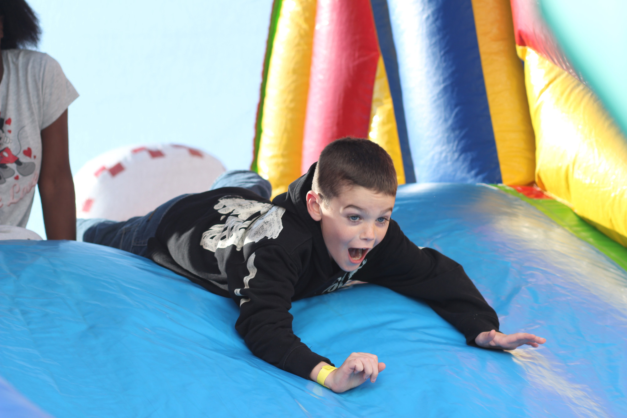 Jason Brady, 8, enjoyed the slide at Meadow School Carnival in Baldwin.  Alongside two bounce houses were carnival games, cotton candy, popcorn, and facepainting to keep the kids busy.